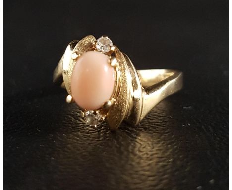 CORAL AND CZ DRESS RINGon fourteen carat gold shank with decorative shaped setting, ring size N-O and 3.7 grams 