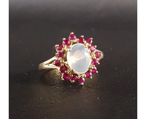 RUBY AND MOONSTONE CLUSTER RINGthe central oval cabochon moonstone in sixteen ruby surround, on nine carat gold shank, ring s