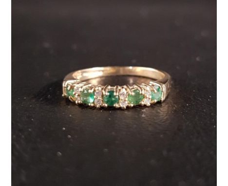 EMERALD AND DIAMOND RINGthe five emeralds separated by smaller diamonds, on nine carat gold shank, ring size N 