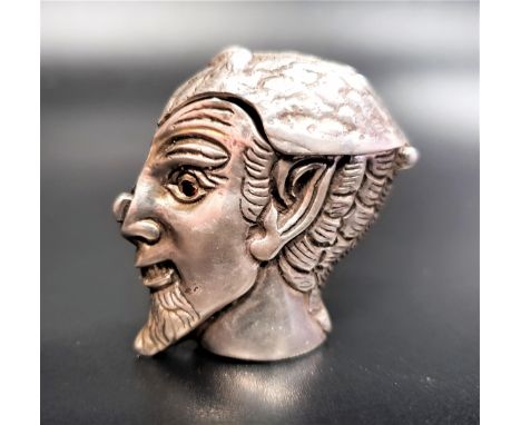 NOVELTY SILVER VESTA CASEformed as Pan or the devil with garnet set eyes, with hinged spring loaded cover and push-button to 