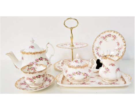 ROYAL ALBERT TEA SERVICEin the Dimity Rose pattern, comprising eight cups, six saucers, tea pot, two tier cake stand, tea bow