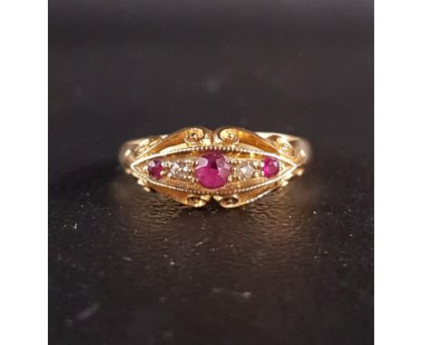 GRADUATED RUBY AND DIAMOND FIVE STONE RINGon eighteen carat gold shank, with pierced scroll decorated setting and shoulders, 