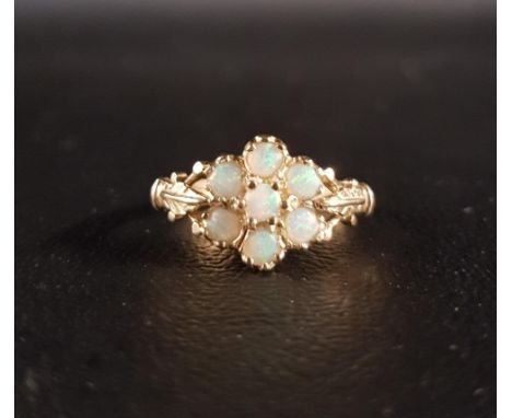 OPAL CLUSTER RINGthe round cabochon opals on nine carat gold shank with decorative shoulders, ring size N 