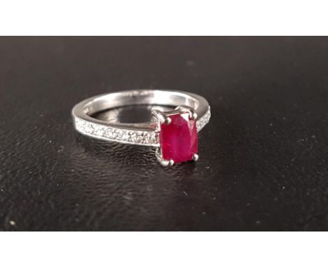 RUBY AND DIAMOND RINGthe central radiant cut ruby approximately 0.95cts, flanked by diamond set shoulders totaling approximat