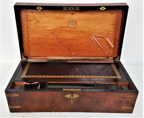 VICTORIAN WALNUT WRITING SLOPEwith an inset brass plaque with inscription to the fold over lid, opening to reveal a part leat
