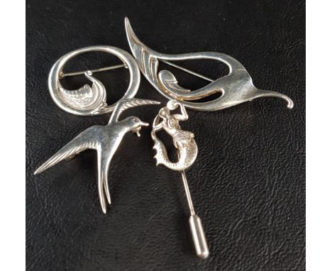 THREE SILVER OLA GORIE BROOCHES AND A STICK PINthe brooches formed as a stylised swan, a swallow and a viking ship's prow, th