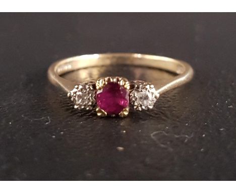 RUBY AND DIAMOND THREE STONE RINGthe central ruby approximately 0.3cts flanked by smaller illusion set diamonds, on nine cara