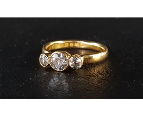 GRADUATED DIAMOND THREE STONE RINGthe bezel set diamonds totaling approximately 0.9cts, on twenty-two carat gold shank, Londo