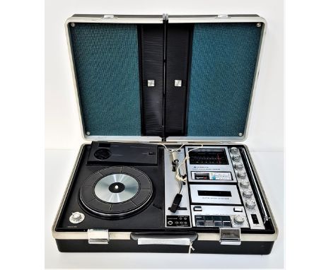 SANYO PORTABLE MUSIC CENTREmodel G-2615N-2, contained in a briefcase, the lid forming two speakers, with a record player, cas