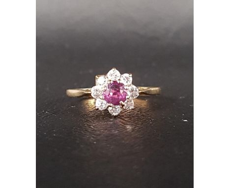 RUBY AND CZ CLUSTER RINGthe central ruby in eight CZ surround, on nine carat gold shank, ring size N 