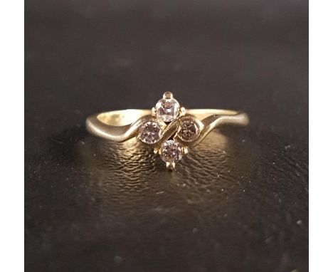 PRETTY DIAMOND FOUR STONE RINGthe diamonds totaling approximately 0.2cts in rhombus shaped setting, on eighteen carat gold sh