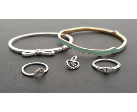 SELECTION OF PANDORA SILVER JEWELLERYcomprising a Sparkling Bow bangle, two rings - Delicate Heart and a Tiara Wishbone, and 