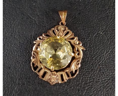 YELLOW GEM SET PENDANTthe large round brilliant cut gemstone possibly a yellow sapphire and measuring 14mmx 14mm x 6.8mm, sus