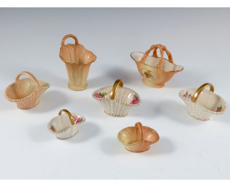 A COLLECTION OF WORCESTER BLUSH AND BASKET WEAVE WITH FLORAL DECORATION MINIATURE BASKETS