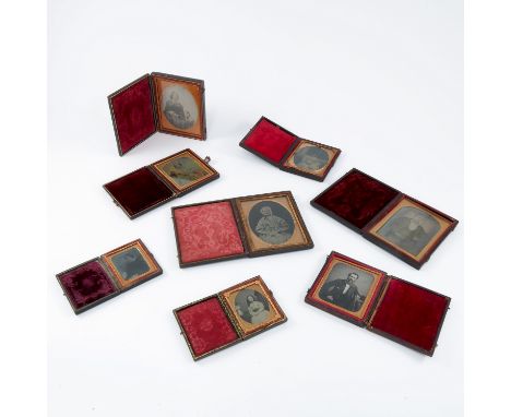 A COLLECTION OF 8 DAGUERROTYPE STYLE PORTRAIT PHOTOGRAPHS IN FOLDING FRAMES