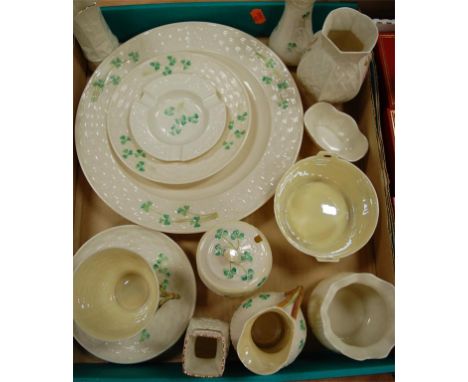A collection of modern Belleek items to include; teacup and saucer, ashtray, cream jug etc 