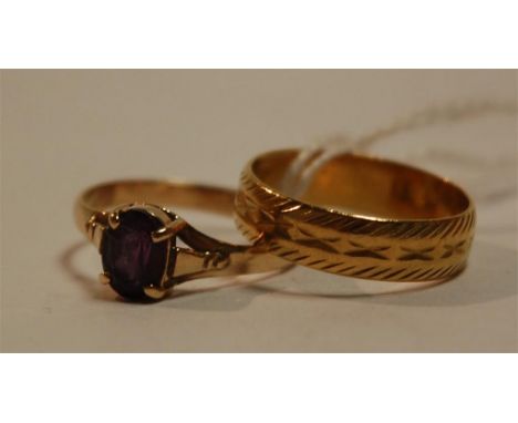 A 22ct gold wedding band, 3.4g together with a 14ct gold amethyst set dress ring (2)