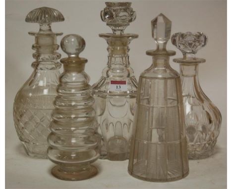 A Regency cut glass decanter, having triple ring neck and mushroom stopper; together with four other glass decanters and stop