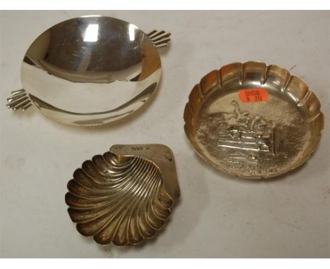 A George V silver porringer of plain circular form with angular twin handles together with a 19th century silver bowl repouss