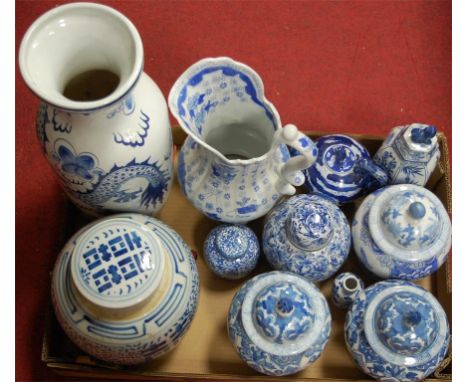 A large modern blue and white vase of baluster form; together with a blue and white wash-jug; various ginger jars; blue and w