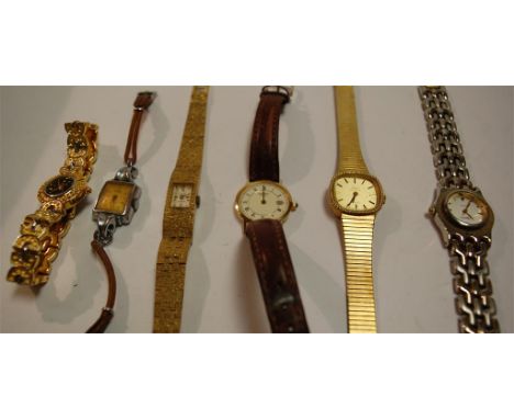 A ladies textured gold plated wrist watch having a blue enamel dial and baton markers together with various other ladies and 