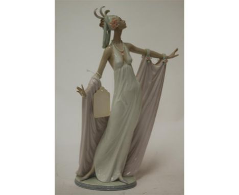 A large Lladro figure, modelled as a 1920s female dancer, printed mark and impressed 1568 verso, h.34cm Condition Report / Ex