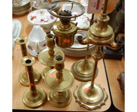 A Victorian brass adjustable oil lamp, lacking shade; together with one other three branch example; and two pairs of turned b