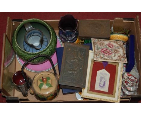 A box of miscellaneous items to include; Elizabeth II commemorative silk tassel, ceramic tiles etc 