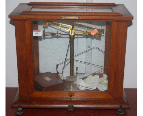 A pair of mid-20th century beech cased brass chemist scales, bearing label for F E Becker & Co of London 