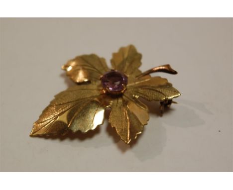 A 9ct gold amethyst set maple leaf brooch, 3.8g Condition Report / Extra Information Measures 4x3cm.No apparent faults.In goo