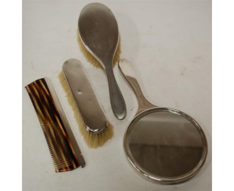 A mid 20th century four piece silver backed dressing table set having engine turned decoration