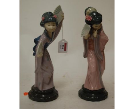 A Lladro figure of a geisha girl together with one other similar (2)