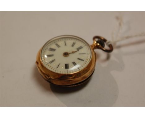 A ladies yellow metal cased fob watch having a jewelled white enamel dial, keyless movement, and ruby and rough cut diamond s