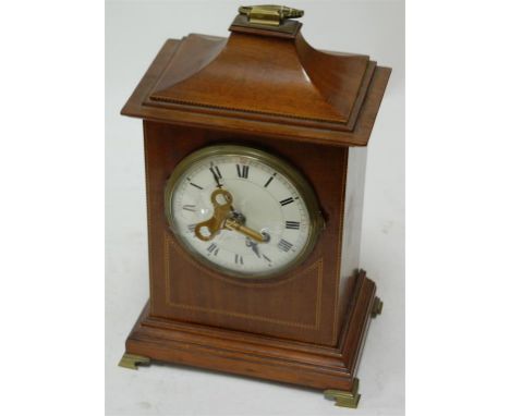 An Edwardian mahogany and chequer strung mantel clock, having a white enamel dial with Roman numerals and eight day movement 