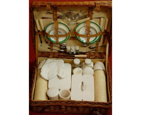 A mid 20th century wicker picnic hamper and contents 