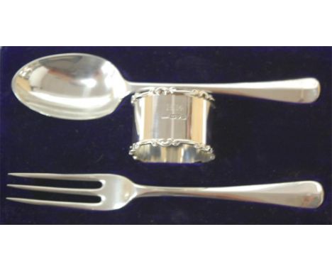 An early 20th century cased silver fork and spoon with associated silver napkin ring