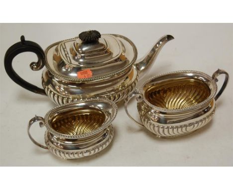 An early 20th century silver plated three piece tea service, of half gadrooned form 