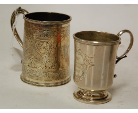 A Victorian silver christening tankard having all over floral engraved decoration initialled cartouche together with one othe