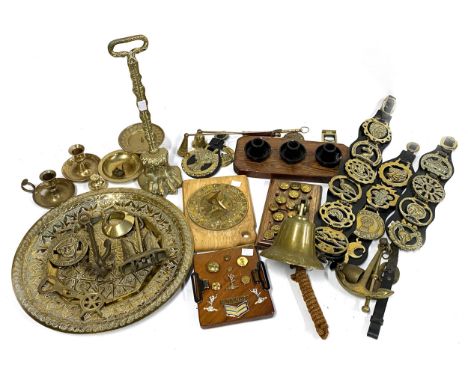 A mixed lot of brass items to include various horse brass including 'Womens Land Army'; candle snuffers; bell; candlesticks m