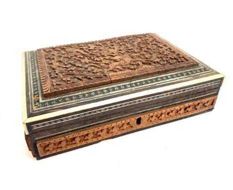 FOREIGN COINAGE. An Indian box c. 8" x 6" filled with 19th/20th C. coinage from across the globe. With a Bakelite pocket ISL 