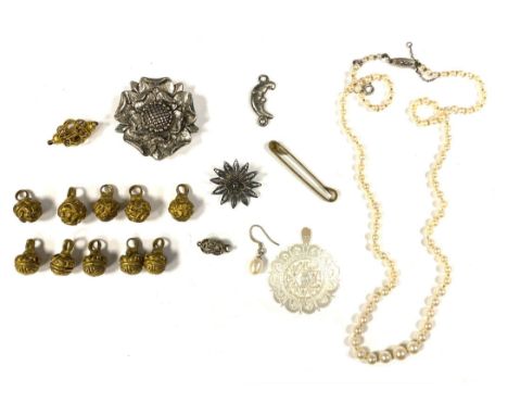 An early 20th century string of cultured pearls, fastening with a silver and marcasite clasp, 51cmL unclasped; together with 
