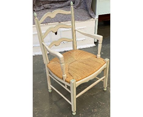 A painted ladder-back open armchair with rush seat