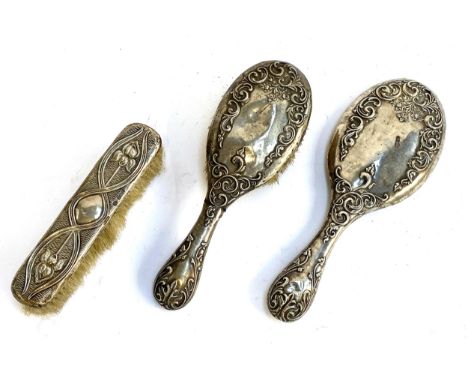 A silver topped Arts and Crafts style brush, hallmarked for A &amp; J Zimmerman Ltd, Birmingham, 1902; together with a furthe