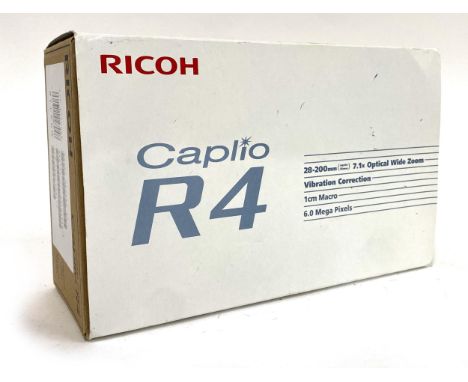 A Ricoh Caplio R4 digital camera, boxed with manual, charger etc