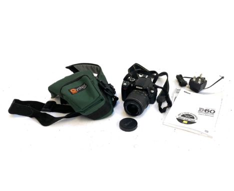 A Nikon D60 DSLR camera, with Nikon 18-55mm Nikkor AF-S lens, with manual