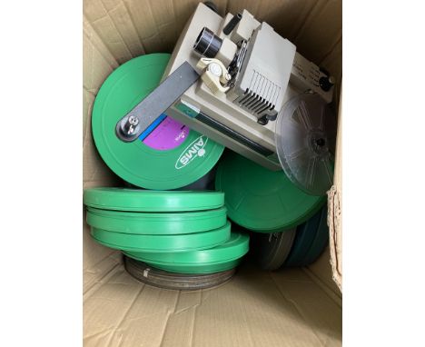 A quantity of film reels together with a Boots Auto Zoom projector