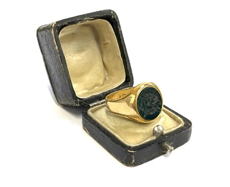 A heavy Victorian 18ct gold signet ring set with a bloodstone intaglio, engraved with the monogram GE, hallmarked for Birming
