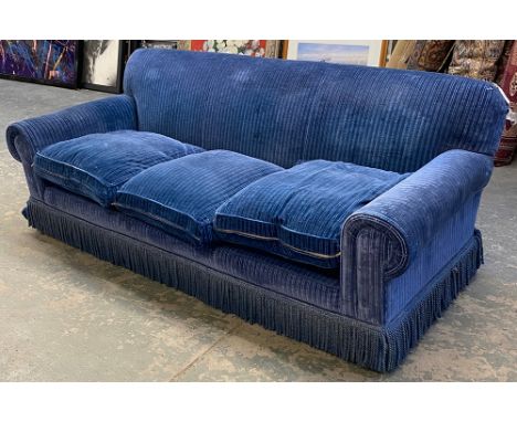 A good quality blue velvet upholstered three seater sofa, feather filled cushions, with fringe, 220cmW
