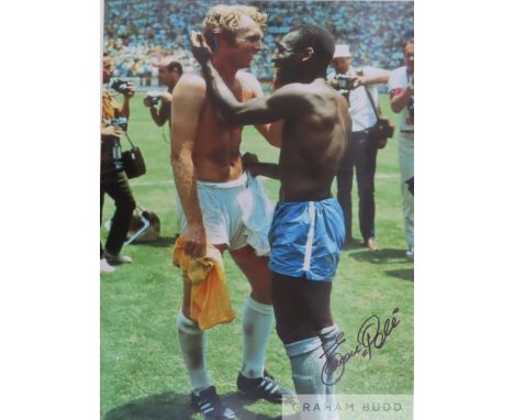 Edson Pele signed colour photograph featuring Pele exchanging shirt with Bobby Moore,&nbsp;
signed in black marker pen, mount