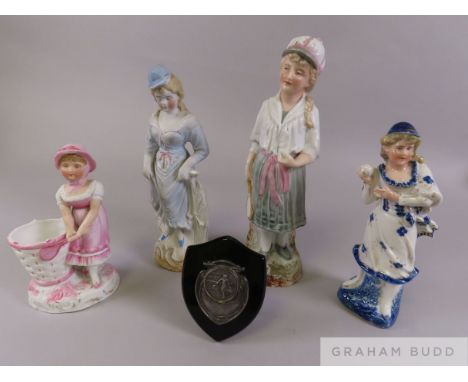 Four tennis related bisque figures and further tennis related memorabilia, comprising a female holding a tennis racquet and b